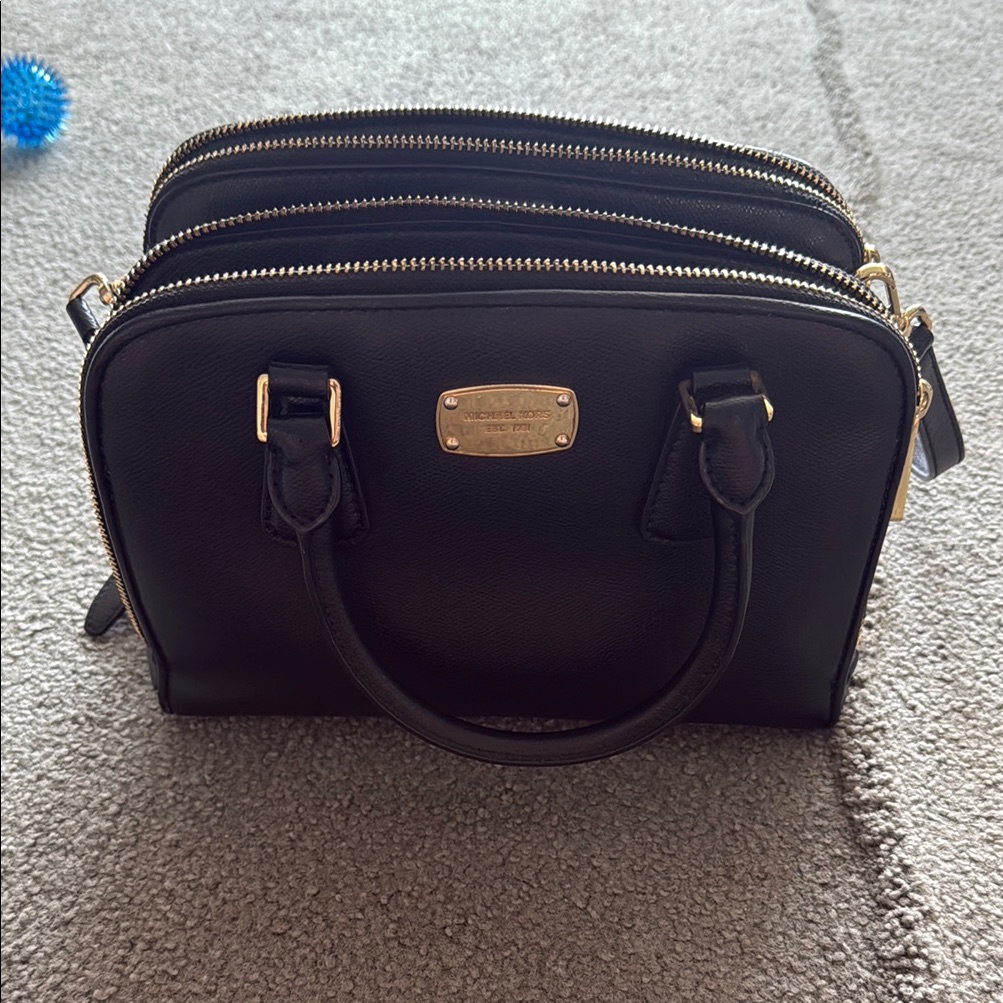 Black Leather Handbag With Gold Accents